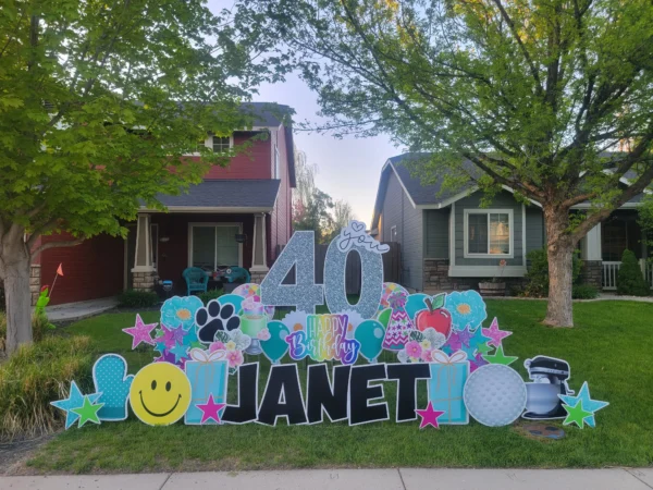 An image of a yard sign with a big number 40, the phrase "Happy Birthday Janet" and other graphics around it.