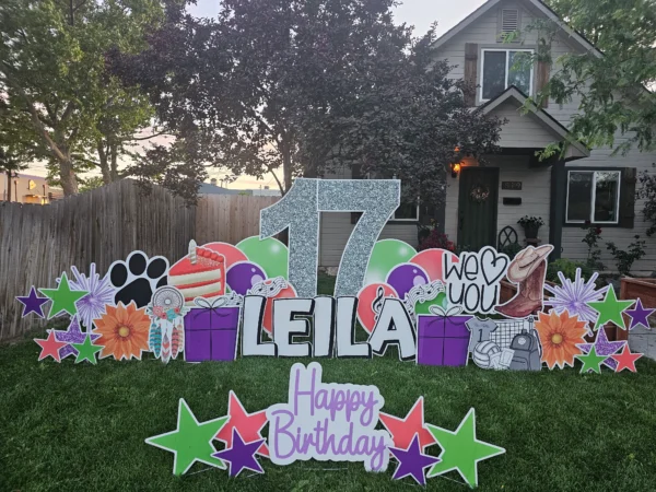An image of a yard sign with a big number 17, the phrase "Happy Birthday Leila" and other graphics around it.